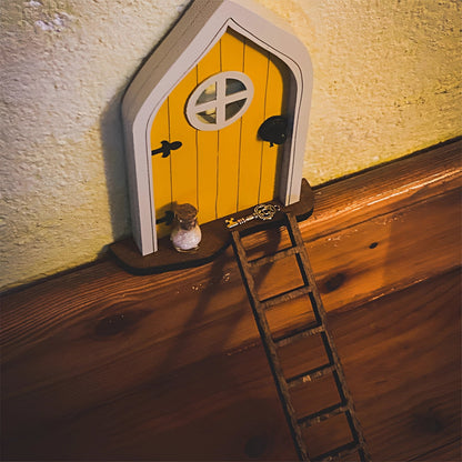 Miniature enchanted tree fairy garden door with intricate wood design featuring amber shades and symmetrical triangular patterns, designed as a whimsical decor accessory.